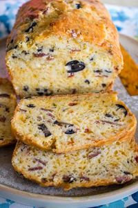 Savory Quick Bread With Cheese And Olives- Delicious quick bread for any occasion. Beautiful ingredients like olives, bacon, bell peppers, cheddar cheese and white wine come together into a great recipe that can be served as appetizer or an accompaniment for a lovely meal. #savoryquickbread #Mothersday #Easter #brunch #breakfast #appetizer