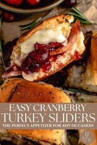 These butter-baked cranberry turkey sliders feature layers of turkey, cranberry sauce, and creamy white cheese sandwiched between sweet Hawaiian rolls.