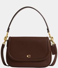 From COACH, the Legacy Small Pebbled Leather Shoulder Bag features: Featuring a COACH logo flap, this Legacy shoulder bag sits just beneath the underarm with the shorter strap or it can be worn as a crossbody. Small sized bag; 10"W x 7-.25"H x 2-.75"D (width is measured across the bottom of handbag); 1.32 lbs. approx. weightApprox. 7-.5" L removable short strap; 21-.5" L r