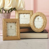 This classic look will never go out of style. Surround your memories with this vermeil ornate golden frame for an elegant and sophisticated look. Simply Backed With an Easel Prop Stand for Table Top Display Material: RESIN Dimensions: 4 1/2" W x 4 1/2" H, 4" W x 5" H, 4 1/4" W x 5" H