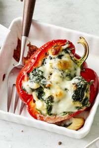 These stuffed bell peppers have a filling inspired by the Greek spinach pie, spanakopita, but you don't have to worry about working with phyllo, so they're great for an easy, quick vegetarian dinner.