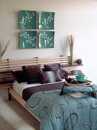 I love the wood headboard and floating tables.