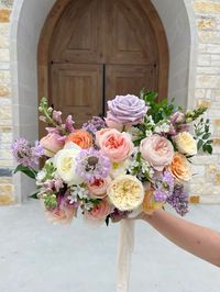 shades of french lavender, ivory and peach make up this charming quaint bouquet