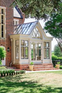 An impressive orangery addition which provides a unique space for dining and relaxing. Framework incorporates architectural bronze casements.