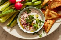 This tangy and creamy dip is the perfect appetizer for a warm summer evening outside, and it makes a nice condiment for grilled meats and veggies, too Fresh green herbs brighten up the salty feta, and sumac gives it another layer of flavor and a gorgeous pop of color Choose a feta in brine over vacuum-packed, if you’ve got the option