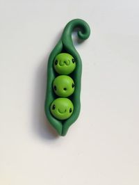 AFOON These cute Kawaii 3 Peas in a Pod are as happy as it gets!   I made this miniature figurine for all the veggie lovers :)   Size:  3" H x 1" W  *Optional editions - free of charge: - Lacquer finish. - Key chain. - Metal clasp for a necklace.   *This is a handmade item, and no two pieces will be 100% the same, meaning that the patterns and colors pictured may vary slightly from item to item, but you will always receive a quality and lovingly-crafted figurine. *Please be careful with the figu