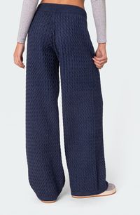 Cable stitching lends flirty detail to cozy pants knit from a chunky yarn and perfected by kicky flare legs. Drawstring waist 50% polyester, 50% rayon Machine wash, dry flat Imported