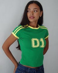 In a green jersey fabric, the Salda top features a bodycon fit with a regular hem, shorts sleeves and a crew neckline. Complete with yellow binding and a bold numeric sports logo centre front. MODEL WEARS SIZE:SMALL - MODEL HEIGHT:5'7 - FABRIC CONTENT: 95% COTTON 5% ELASTANE