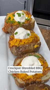 Crockpot shredded bbq chicken in baked potatoes.