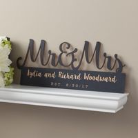 This personalized Mr. and Mrs. Black Wood Plaque is a great gift that adds charm to any home dcor! This customized plaque is an ideal anniversary or wedding keepsake. Make it one-of-a-kind for that special couple by adding personalized text that features the couples name and an important date.