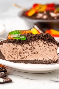 Quick and easy No-Bake Dirt Pie is a delicious Oreo Crust filled with chocolate pudding and topped with crushed Oreos and gummy worms. Perfect for a cool dessert during the summer or fun for an easy Halloween Dessert!