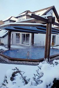 Sliding roof/pool cover. The cover slides up and down and doubles as a roof/pool cover