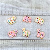 These frosted animal cookie magnets are the perfect gift for a food lover and a pop of color to brighten up your kitchen, classroom, locker, and any other magnetic surface! Each magnet is hand sculpted out of polymer clay.  Keep in mind that these are handmade; each creation is unique and may not be identical to the photo due to them being crafted by hand and not by a machine that can recreate several identical items! (meaning you will be receiving the item pictured, but it may slightly vary in