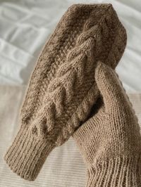 Cable mittens knitted in Drops Lima