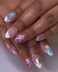 French tip + purple, blue, and chrome stars on gel-x nails