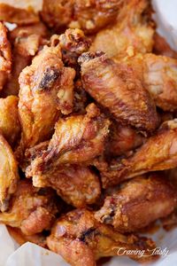 These baked chicken wings are extra crispy on the outside and very juicy inside. They are like deep-fried wings, only without a mess and added calories. Oh, and they only take 30 minutes to bake. | Craving Tasty