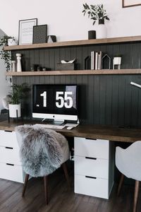 Wow! Stunning office space! Love the before and after of this nook. They took a blank wall and turned it into a beautiful modern computer desk with floating shelves and a black, vertical shiplap background. love the monochrome design and the modern grey desk chairs. Beautiful transformation! #nordic #scandinavian #moderndesign #blackandwhite #office #desk #computer #diyshiplap