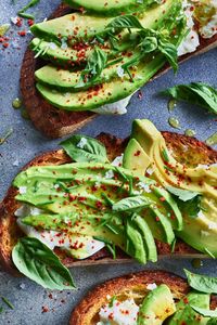 Burrata (cream-filled fresh mozzarella cheese) takes this avocado toast recipe to the next level for a decadent, yet weekday-friendly breakfast. #breakfast #healthybreakfast #breakfastideas #brunchideas #healthybreakfastrecipes #breakfastideas #brunchideas #recipe #eatingwell #healthy