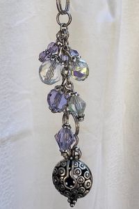 Violet Czech glass beaded purse charm. That hangs 4 1/2 inches long. All orders come in a gift box.