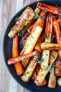 Delicious Honey Roasted Carrots & Parsnips are an easy side dish that goes with everything. Just a few simple ingredients and 30 minutes in the oven!