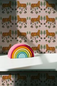 Tiger Wallpaper. Beautiful jungle wallpaper for a unisex children bedroom or nursery. Let them go wild and inspire them. Hand designed by Annika Reed Studio luxury wallpaper made using traditional woodblock printing. Comes in 2 colourways and bespoke colour on request. Bold and beautiful wallpaper for the perfect home. #kidswallpaper #kidsnursery #designideas #childrensbedroom