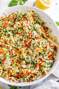 This Rainbow Orzo Salad makes the perfect summer side dish!  Loaded with colorful veggies, fresh herbs and tender orzo pasta, all tossed together with a delicious lemon herb dressing and easily made in just minutes!