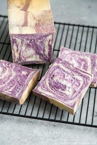 This Ube Milk Bread combines Hokkaido milk bread dough with dehydrated ube purple yam powder to create a soft and fluffy colorful loaf! Perfect for toast or