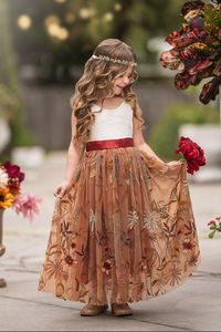 Sleeveless Floral Embroidered Burnt Orange Flower Girl Dress Elevate your little one's charm with our exquisite Sleeveless Floral Embroidered Burnt Orange Flower Girl Dress, the perfect choice for fall weddings. This dress is designed to capture the essence of autumn with its stunning multicolor fall floral embroidery, delicately adorning a bridal-grade tulle skirt. Key Features:- Main Keyword: Flower Girl Dresses- Sleeveless Floral Embroidered Design: This flower girl dress features intricate f