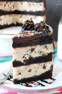 This Cookie Dough Brownie Layer Cake with funfetti is a totally decadent treat! Layers of brownies and edible funfetti cookie dough are topped with a delicious chocolate ganache & more sprinkles! #funfetti #layercake #brownies #cookiedough #ediblecookiedough #cookiedoughcake #layercake #browniecake