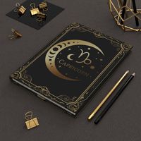 Channel your Capricorn energy with this stunning astrology-themed hardcover journal. Perfect for personal journaling, note-taking, or creative writing, this 5.75" x 8" notebook features a beautiful gold Capricorn zodiac design on a sleek matte-finish cover. With 150 lined pages, you'll have plenty of space to capture your thoughts and ideas. The durable casewrap binding ensures longevity, while the matte laminate coating keeps your journal looking stylish and sophisticated. it's an excellent gif