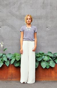 Plain grey tee, collar necklace, and wide leg white pants (I'd like it better with a maxi skirt)