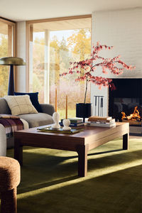 Bring the feeling of the outdoors in with deep greens + natural materials that create an earthy living room. Get set for fall with AllModern.