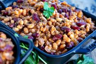 The very best Slow Cooker Cowboy Beans! This easy recipe is so hearty and filling and just perfect for chilly weather! Loaded with three types of beans, bacon, and beef, this family favorite is frequently served up at holiday gatherings, potlucks, and parties and is a must for game day. // Mom On Timeout