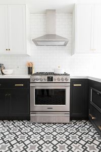 Beautiful two-toned @semihandmade cabinets in a small, bright kitchen