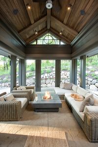 The screened-in porch features stained shiplap ceiling and dark trim painted in Sealskin Sherwin Williams SW7675.