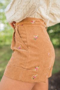 Details Brown Floral Embroidered Corduroy Shorts Fabric has no stretch Functional belt loops and pockets, rolled hem, embroidered flowers Pair these shorts with a cute sweater! Unlined Size small inseam: 3" Material and Care 100% polyester Machine wash cold, no drum drying Patterns may vary Materials may have natural variations Colors may vary from different viewing devices.