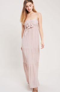 Romance waits for you in the Falling In Love Tie-Front Tiered Blush Maxi Dress! Lightweight fabric, in a blush pink hue, covers a thin strap sweetheart bodice that tops off a fitted empire waist (with a tying front top). An A-line cut tiered skirt flows to a stunning maxi-length. Smocked back and removable adjustable straps. Lined.