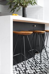 Patterned cement tile and two tone cabinets in a small kitchen