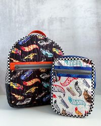 We have some fun, playful bags on the blog today made by Kelly @bykellyrenay! 🏎️

In order to show off the Hot Wheels Made to Race fabrics, Kelly selected a few iconic Hot Wheels prints for the Athena Crossbody and The Violet Backpack patterns by Knot and Thread Design. Race over to the blog for fabric details and links to the patterns! 