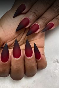 Get a stylish edgy twist with these stunning red & black almond nails. This unique nail design is perfect for making a bold statement and adding some attitude to your look. Whether you’re going for a night out or just want to express your individuality, these nails will definitely turn heads. The combination of the vibrant red and sleek black colors creates a striking contrast that is sure to make you stand out. Elevate your manicure game with these fierce and sophisticated almond nails today!