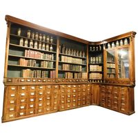 For Sale on 1stDibs - Antique pharmacy in walnut with drawers, raised a day, Swiss origin, second half of the 19th century, composed of a corner unit and a small piece of furniture.