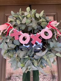 This xoxo wreath banner is the festive addition to any area.