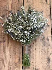 "*OUR DESPATCH TIMES FOR BOUQUETS ARE CURRENTLY 6-8 WEEKS AS WE ARE EXPERIENCING A PARTICULARLY BUSY PERIOD. Air dried Gypsophila, dried Oats, dried Lavender and dried Green Thistle bouquet. 3 sizes available Flower girl- approx 6\" across Bridesmaid- approx 8\" across Bridal- approx 10\" across (Pictures are of the Bridal size) Finished with either- Natural jute twine with bow Cream satin trailing ribbon  Beautiful bouquets perfect for a rustic country wedding theme, can be kept afterwards as t