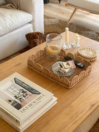 How to upscale your coffee table: candles (more than 1 at different heights, coffee table books, cute tray, mix of old and new pieces #coffeetablestyling #coffeetableideas #interiordesignideas #homedesign #homedecorlivingroom