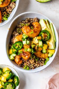 These fresh and delicious Teriyaki Shrimp Quinoa Bowls seasoned with honey, ginger, and soy sauce are topped with avocado and a Cucumber Salsa. #quinoa #grainbowls #shrimp #healthyrecipes #weightwatchers #dinner #macros