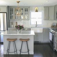 Grayeige cabinets with white subway tile