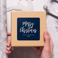 AD: Modern holiday stickers featuring "Merry Christmas" displayed in white brush script lettering with a navy background. Personalize the simple Merry Christmas stickers with your name and year in white lettering. The navy and white Christmas stickers are perfect for sealing holiday envelopes, party favor bags, and gifts. Designed by Late Bloom Paperie for Zazzle.