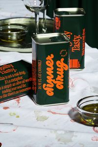 Giovanni Stillittano of Auge Design channeled the druggy, debaucherous '80s in his packaging, with bubbly typography that switches between elegantly wasted cursive to a more serious, old-fashioned serif. A warm, nostalgic color palette makes the sunny orange text pop against forest green like the pit in an olive.