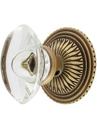 Stunning oval crystal knobs add a distinctive touch to our vibrant Sunburst rosette set.   Designed in the tres-chic French Regency style, this door set would have graced fashionable interiors from Hollywood to Miami throughout the 1930s.  Simple installation and seven stylish finishes make this the perfect way to glamorize your home, as well.