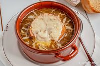 The most delicious French Onion Soup cooked right in the crockpot. It's easy to make, packed with flavor, and makes a perfect lunch or dinner. #dinner #sidedish #soup #freezerfriendly #kidfriendly #makeahead